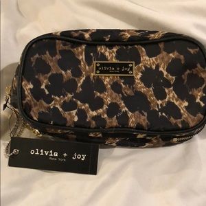 Cosmetic bag by Olivia &Joy New York.